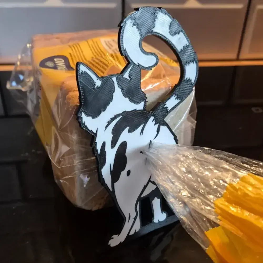 Prendedor de pão gato curioso